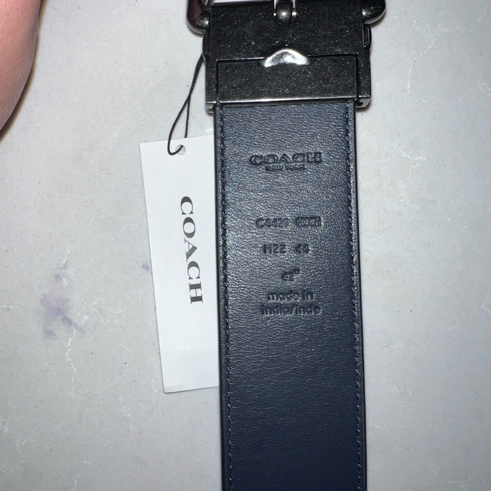 Men's Coach dark blue belt.